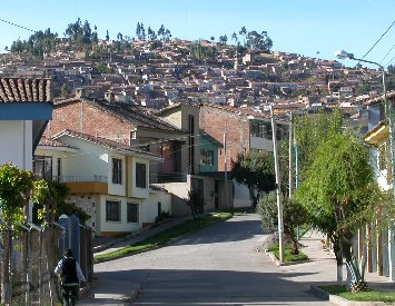 Houses march up the hillside